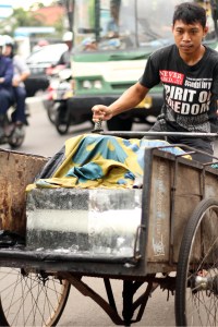 ..and I'm also think this is also only happen in Indonesia. He is non food-grade ice cube seller. People usually using it for coolbox. Every morning, He delivered the ice cube to his customers. He cuts the ice cube depending on customers need. Interesting kind of Job.. (y)