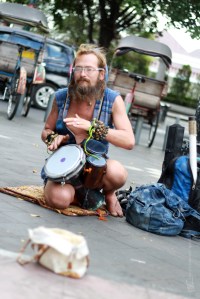 Maybe, this is the rule of travelers logic of thinking, if you need money, just do something to attract people to give their coins or small change. This foreigner is in Malioboro Street of Yogyakarta, Indonesia